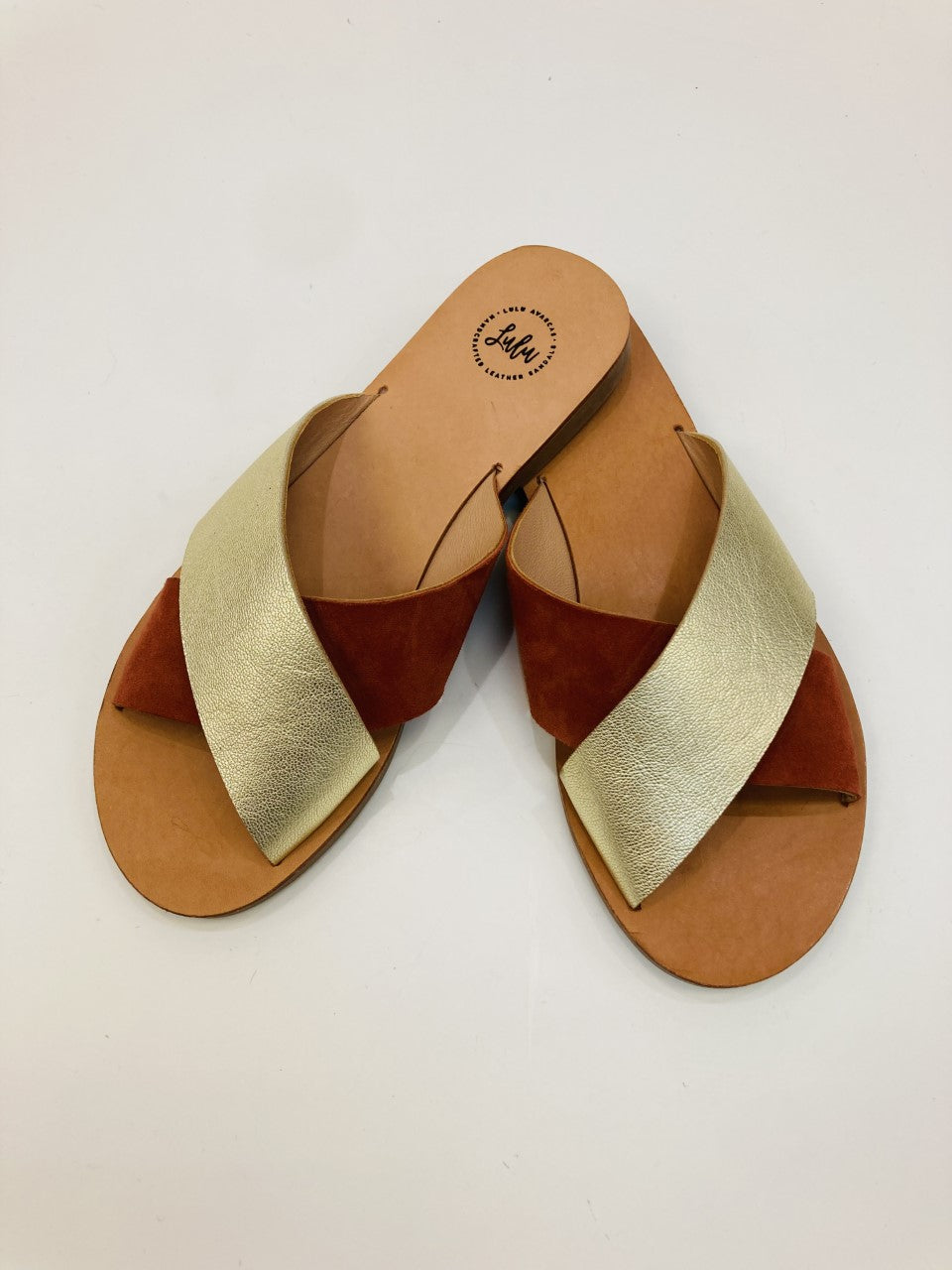 LULU AVARCAS CROSS OVER LEATHER SLIDE IN RUST AND GOLD